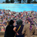 Panneau de photographies de jeunes capturés ou tués lors du festival Supernova le 7 octobre 2023 (Photo Jack Guez/AFP)